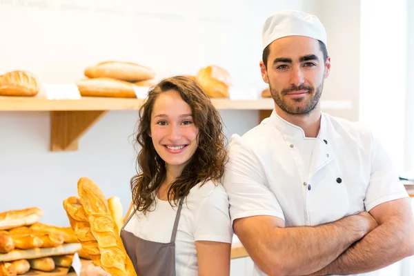 Team of bakers working at the bakery — Stock Photo, Image