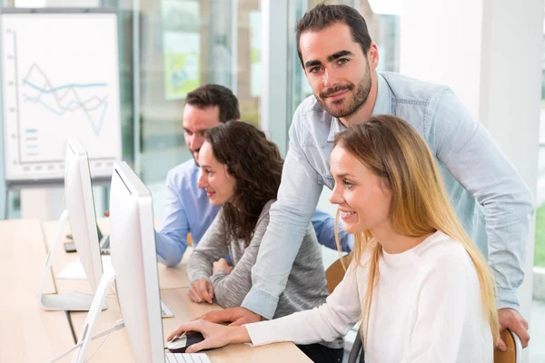 Young attractive people taking a training course with formator — Stock Photo, Image