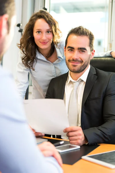 Attractive boss doing interview with his assistant — Stock Photo, Image