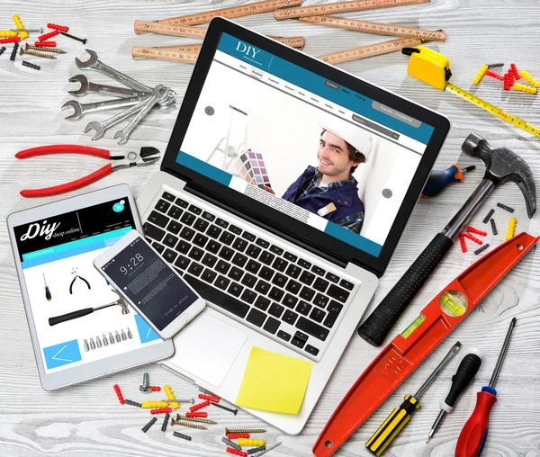 Wood handyman's desk in high definition with laptop, tablet and — Stock Photo, Image