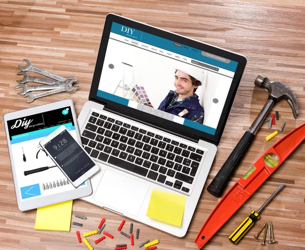 Wood handyman's desk in high definition with laptop, tablet and — Stock Photo, Image