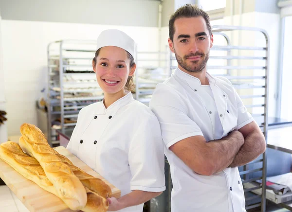 Team of bakers working at the bakery — Stock Photo, Image