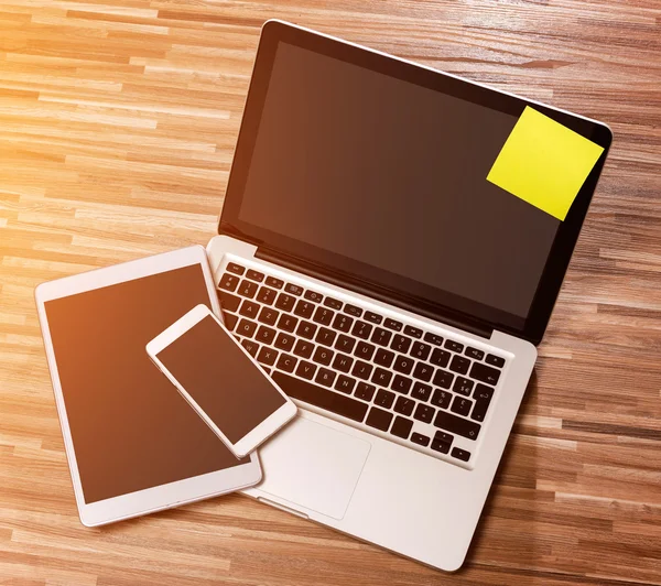 Laptop in high definition with tablet and mobile phone on a wood — Stock Photo, Image