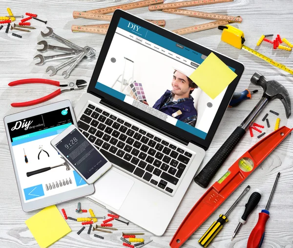 Wood handyman's desk in high definition with laptop, tablet and — Stock Photo, Image