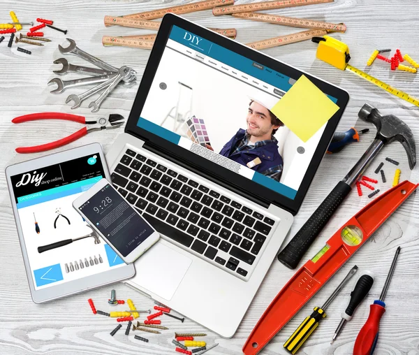 Wood handyman's desk in high definition with laptop, tablet and — Stock Photo, Image