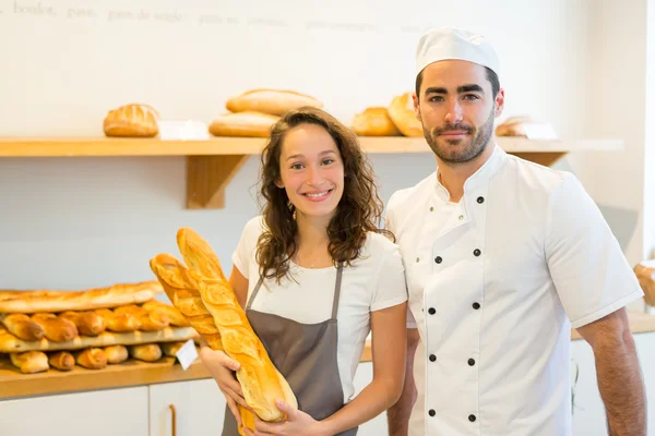 Team of bakers working at the bakery — Stock Photo, Image