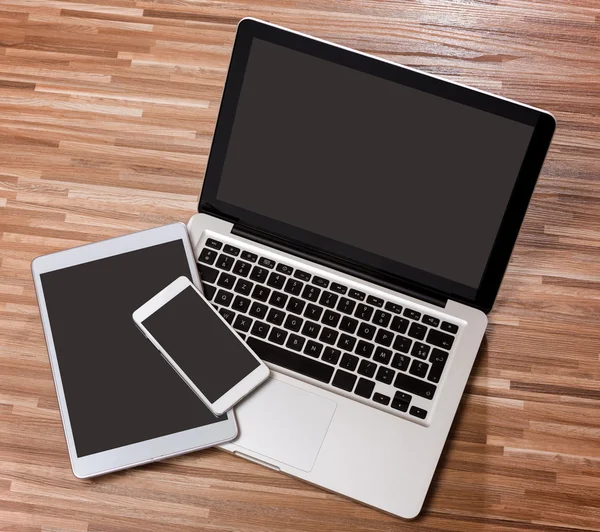 Laptop in high definition with tablet and mobile on a wood backg — Stock Photo, Image