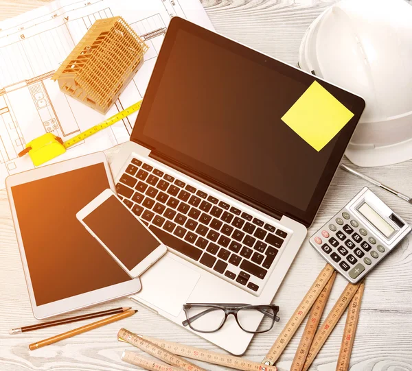 Wood architect's desk in high definition with laptop, tablet and