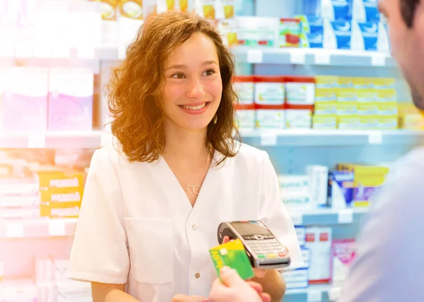 Young Attractive pharmacist at work — Stock Photo, Image