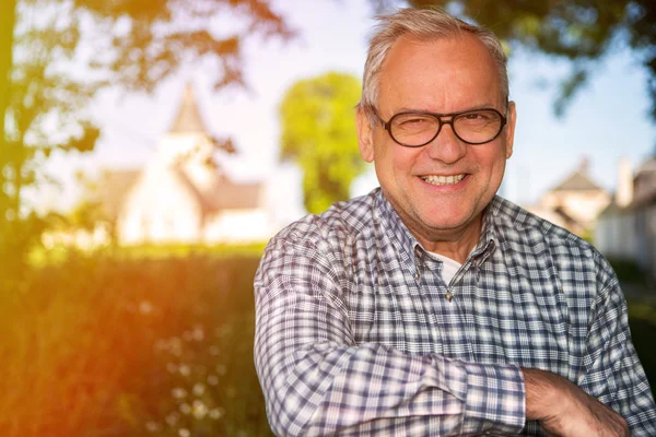 Portrait of an attractive senior in countryside — Stock Photo, Image