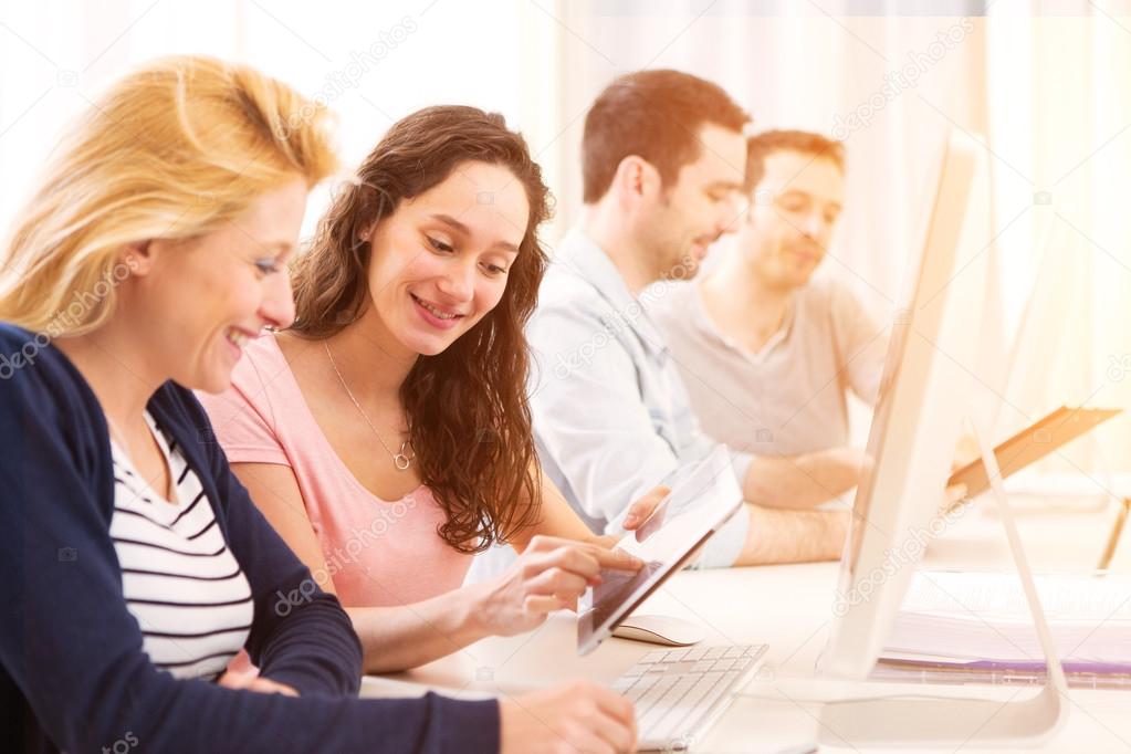 Young attractive people working together at the office 