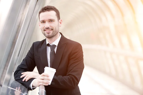 Young attractive business man in business district — Stock Photo, Image