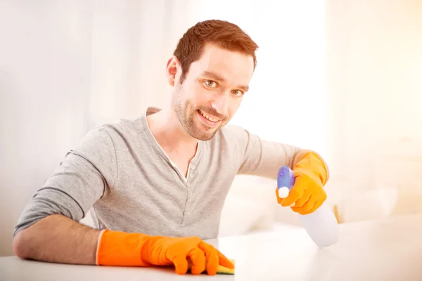 Young attractive man cleaning his flat — Stock Photo, Image