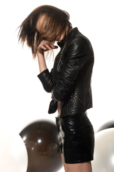 Auburn hair and black leather — Stock Photo, Image