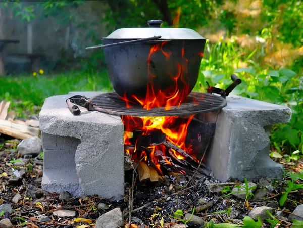 Pot on the fire outdoors — Stock Photo, Image