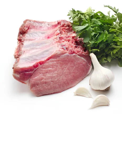 Raw meat with parsley and garlic — Stock Photo, Image