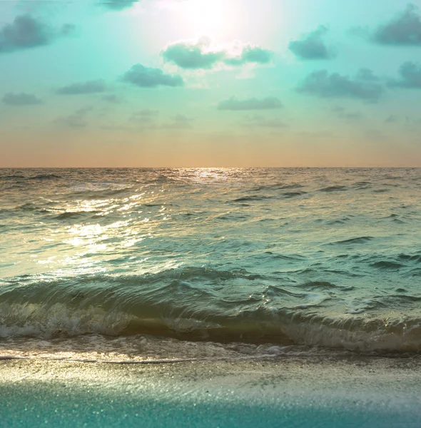 Turquoise sunset on the seashore — Stock Photo, Image