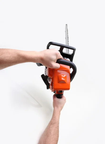 Man hands holding a chainsaw — Stock Photo, Image