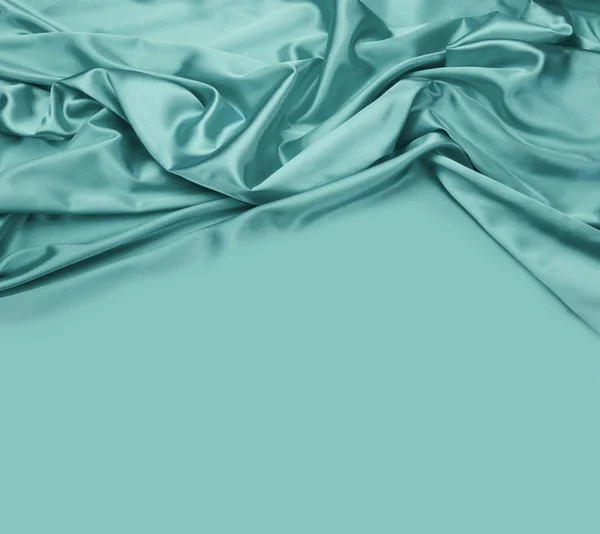 Turquoise silk fabric background — Stock Photo, Image