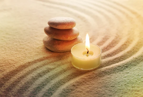 Stones and light candle — Stock Photo, Image