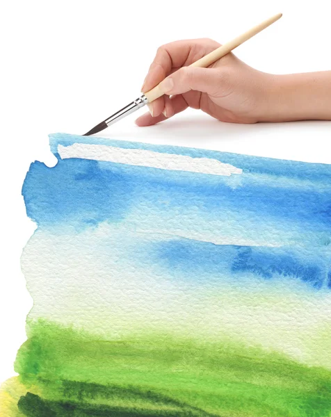 Hand with paint brush and color painted background — Stock Photo, Image