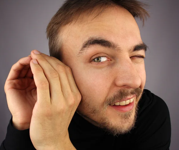 Portrait of cunning man, that  listens carefully — Stock Photo, Image