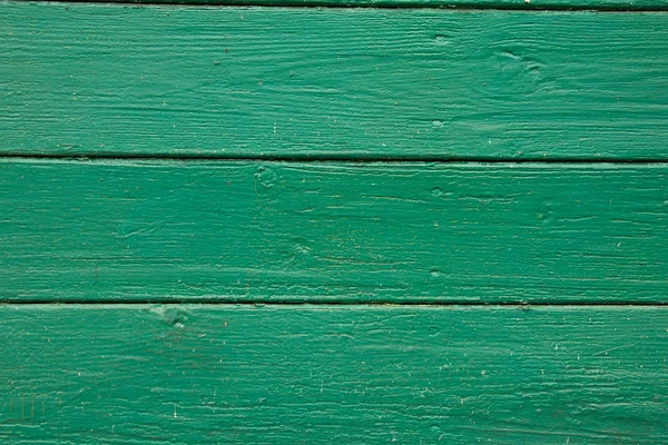 Horizontale grüne Holzplanken mit abblätternder Farbe, Textur — Stockfoto