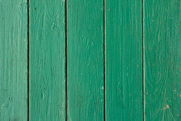 Tavole di legno verde verticale con vernice peeling, texture — Foto Stock