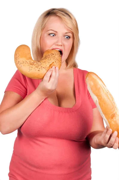 Young woman eating bread isolated — Stock Photo, Image