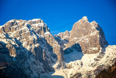 Dolomites mountain range in winter, Dolomiti di Brenta seen from Andalo ski resort in Trentino, Italy