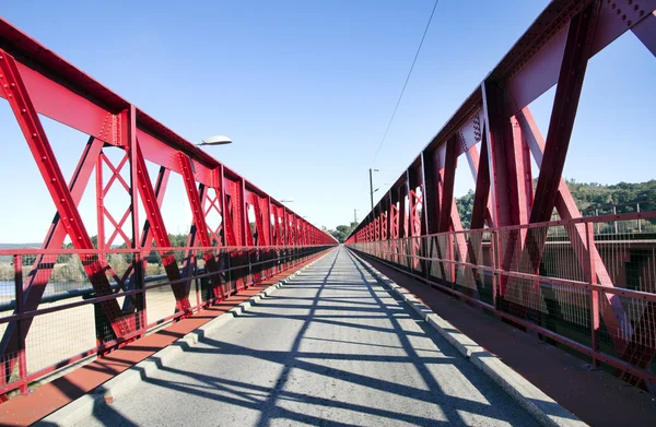 Red painted metal road bridge — Stock Photo, Image