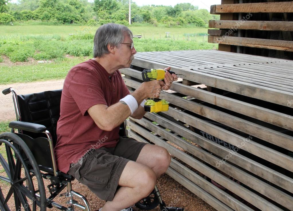 Disabled Carpenter in a wheelchair — Stock Photo © dcwcreations 114357054
