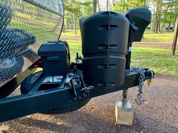 Electric trailer hitch jack on a camper