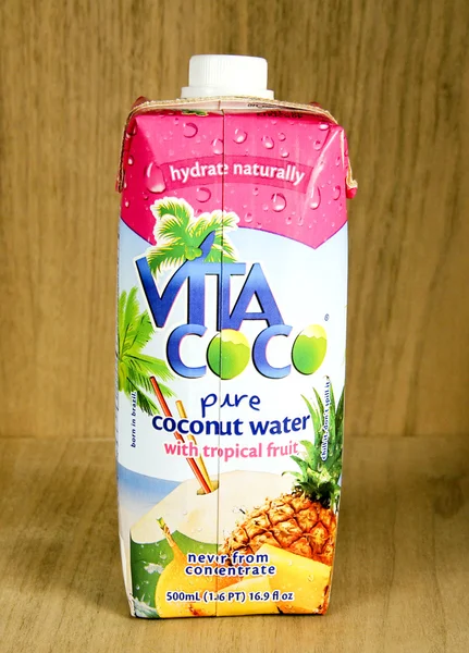 Bottle of Vita Coco Coconut Water with tropical fruit — Stock Photo, Image