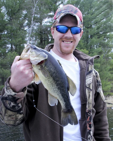 Fisherman with a Largemouth Bass — Stock Photo, Image