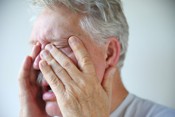 Cold or flu symptoms in a senior man