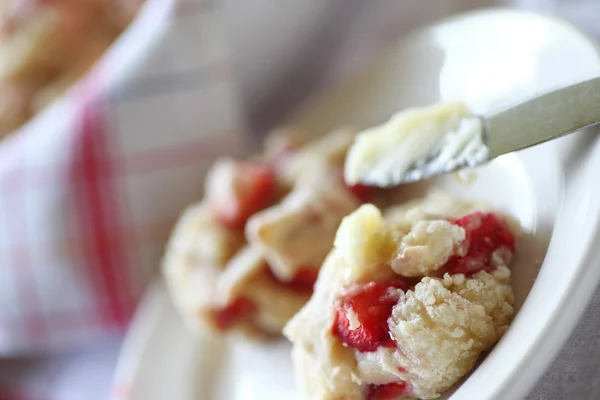 Buttering a warm drop biscuit — Stock Photo, Image