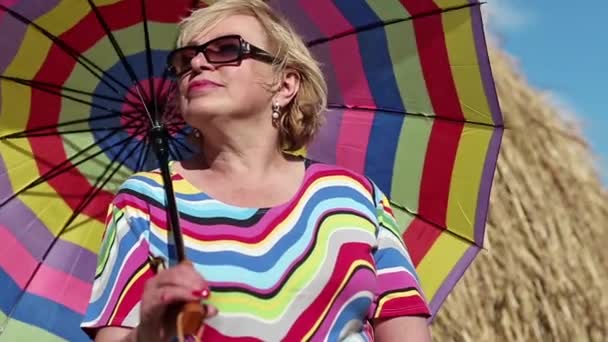 Senior woman with umbrella — Stock Video