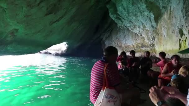 People on motorboat in grotto — Stock Video