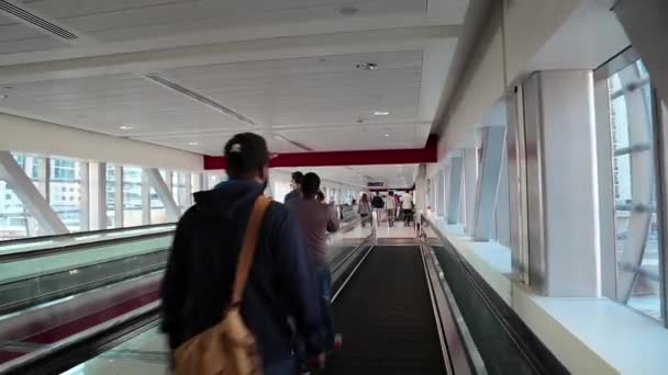 People on travelator inside Dubai — Stock Video
