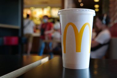 KYIV, UKRAINE, 29 Haziran 2020: Shake on the table and people in McDonalds fast food restaurant in Kyiv, capital of Ukrayna