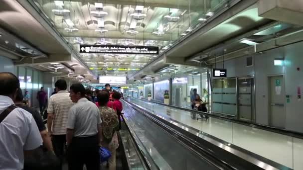 People on travelator inside international airport — Stock Video