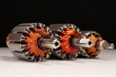 Rotors of electric motors with copper coil from two percussion massagers and kitchen blender