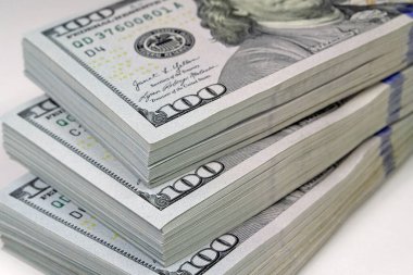 Thirty thousand of american dollars. Three packs of one hundred dollars. New hundred dollar bills, USD. Cash, finance, savings, wealth