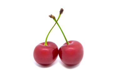 Two juicy cherry berries isolated on white background.