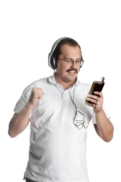Mature man listening to music on headphones — Stock Photo, Image