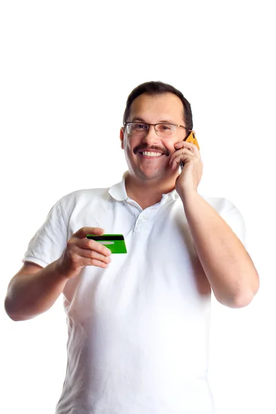 Зрелый человек занимается телефонным банкингом и дает банку — стоковое фото