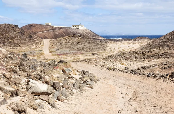Farol de Punta Martino na pequena ilha de Lobo — Fotografia de Stock