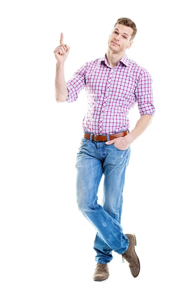 Handsome and sportive young man pointing at empty copyspace, iso — Stock Photo, Image