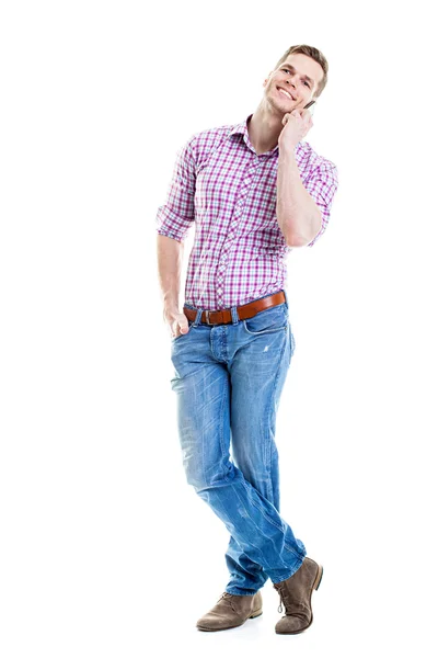 Full length portrait of a smiling student talking on a phone iso — Stock Photo, Image